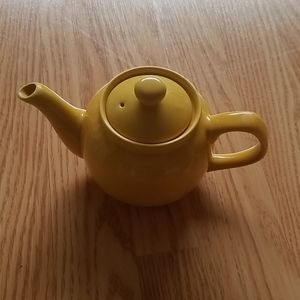 Small yellow ceramic teapot